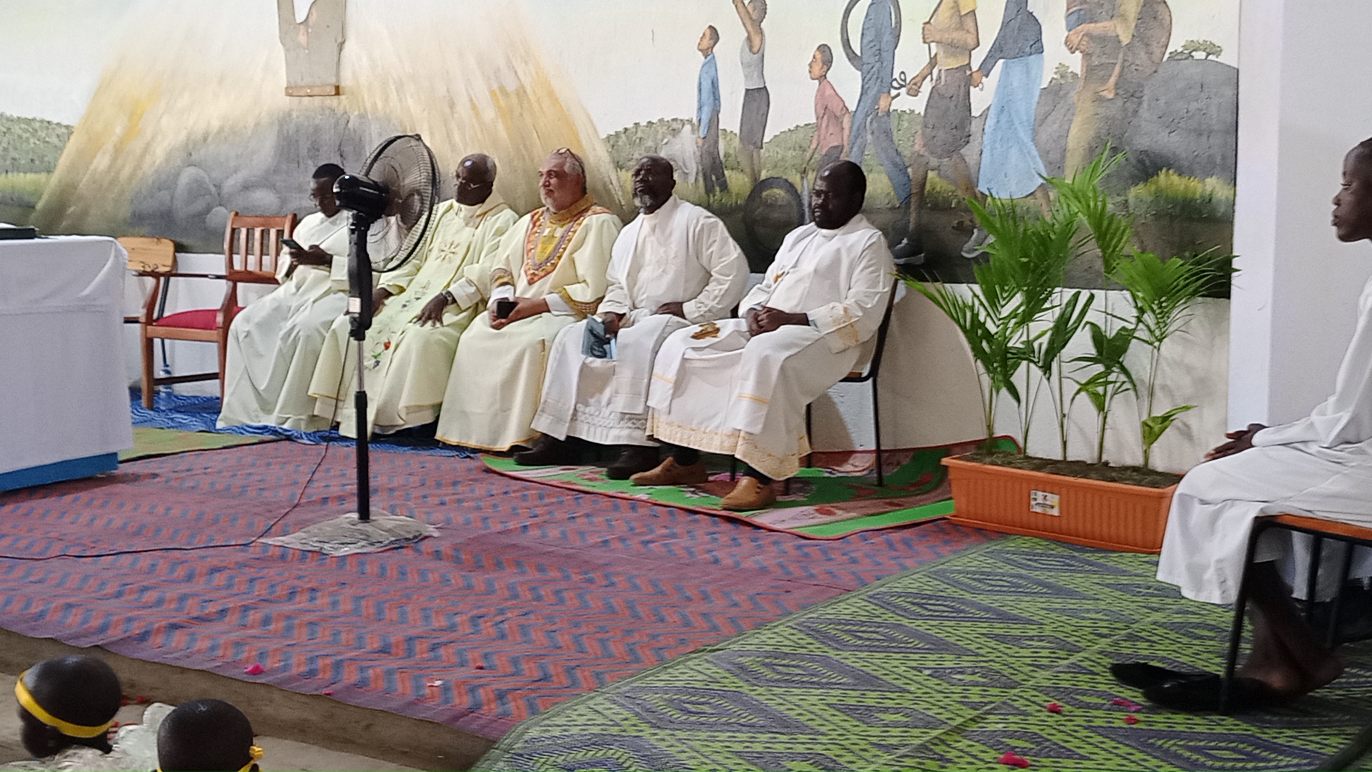 A group of priests in the Holy Mass at the Newly constructed Church in Don Bosco VTC-Palabek